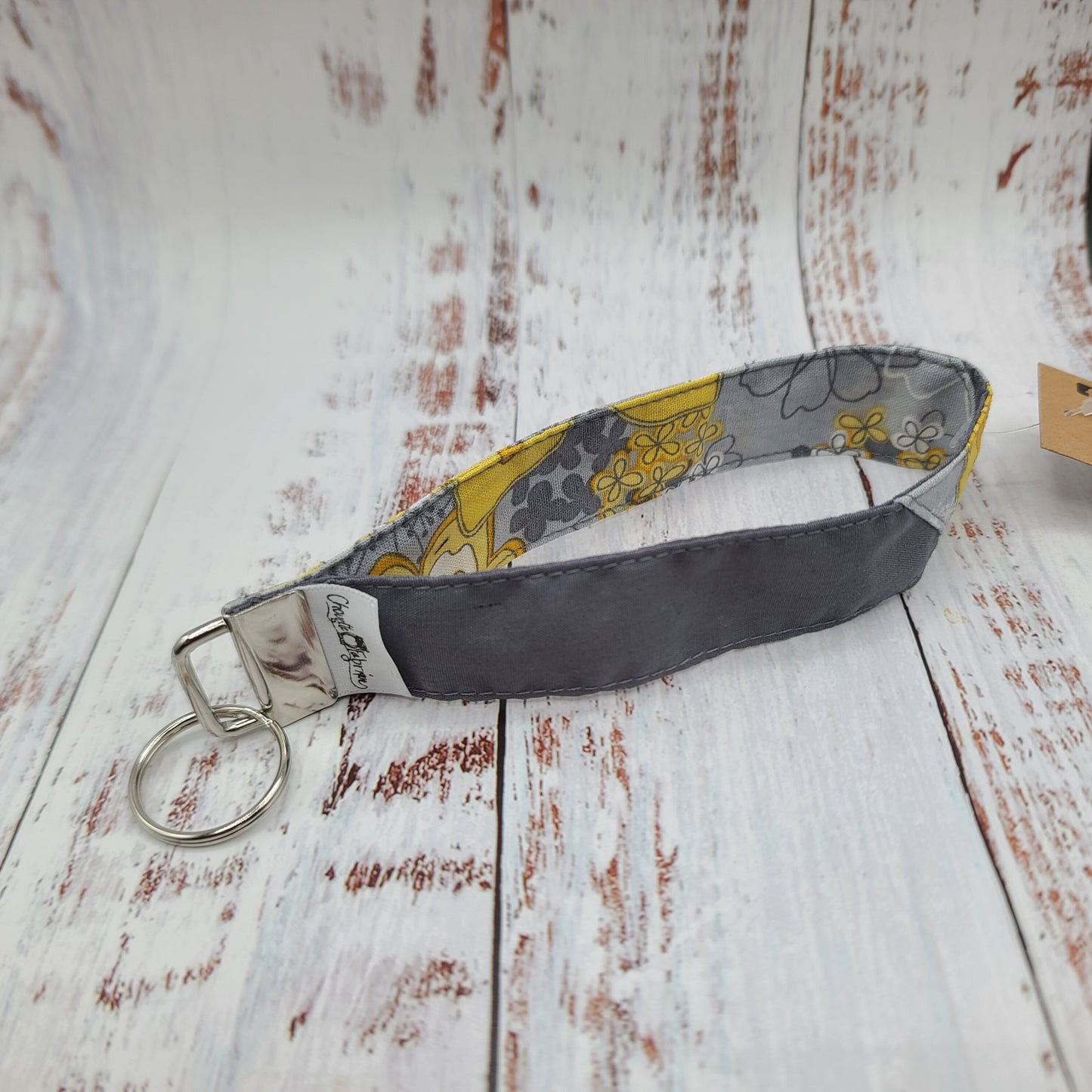 Porte-clé - PERSONNALISÉ - Dragonne - Poignet - Fleurs jaunes - Bande grise