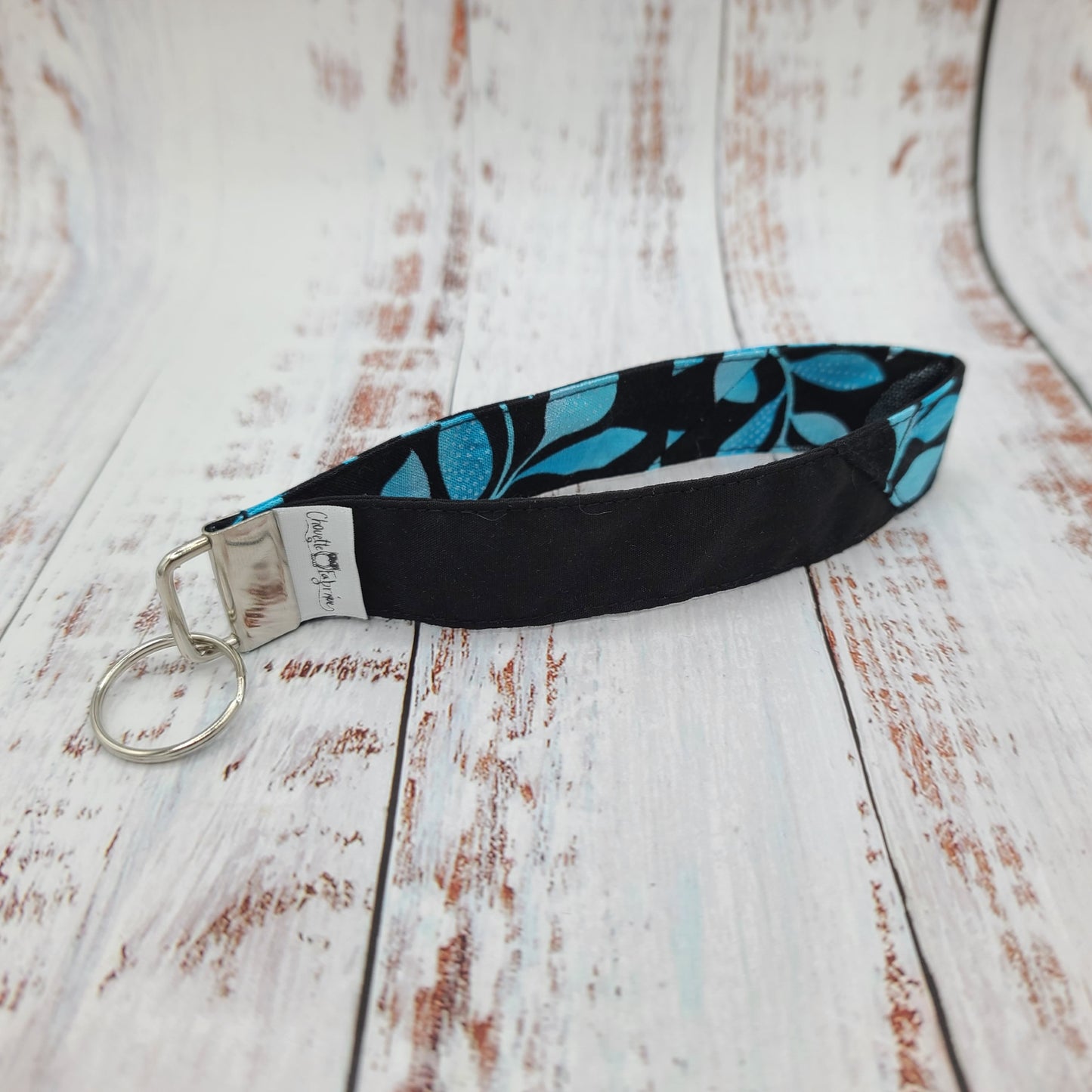 Porte-clé - PERSONNALISÉ - Dragonne - Poignet - Feuillages tons de bleus - Bande noire