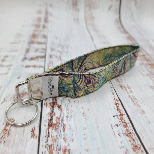 Porte-clé - Dragonne - Poignet - Plumes de paons violet et aqua (Sans impression, motifs tout le tour)