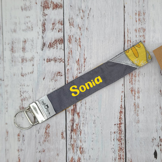 Porte-clé - PERSONNALISÉ - Dragonne - Poignet - Fleurs jaunes - Bande grise