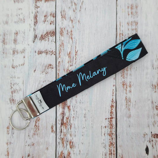 Porte-clé - PERSONNALISÉ - Dragonne - Poignet - Feuillages tons de bleus - Bande noire